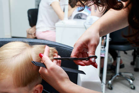 the little boy in a hairdressing salon