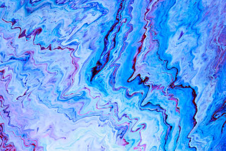Abstract background of acrylic paint in blue and purple tones