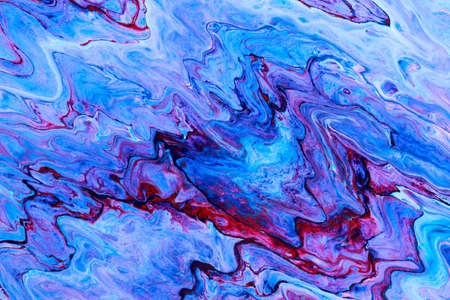 Abstract background of acrylic paint in blue and purple tones