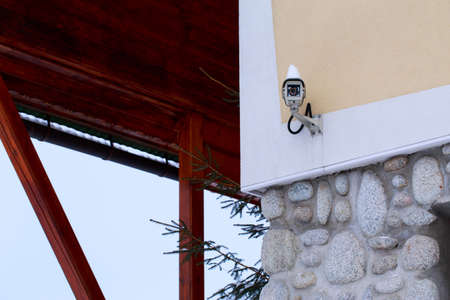 the surveillance camera on a wall of building