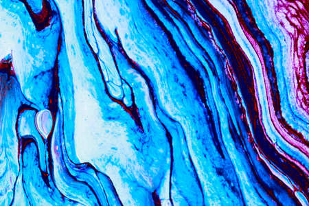 Abstract background of acrylic paint in blue and purple tones