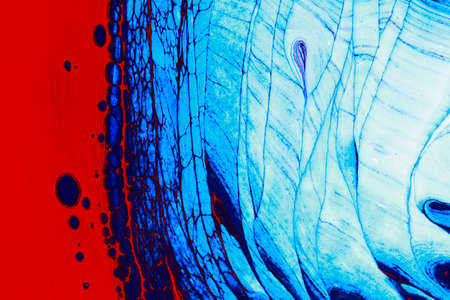 Abstract background of acrylic paint in blue and red tonesの写真素材