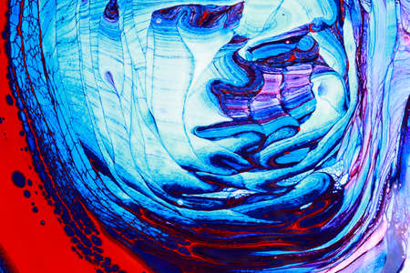 Abstract background of acrylic paint in blue and red tonesの写真素材