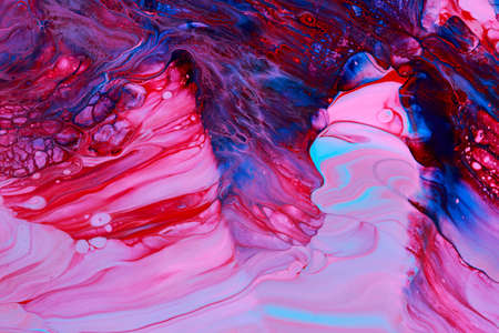 Abstract acrylic paint background in red blue and violet tones