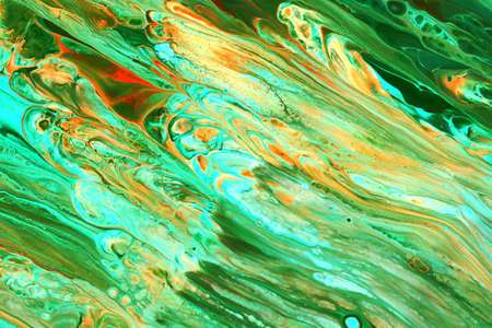 Abstract background of acrylic paint in orange tones