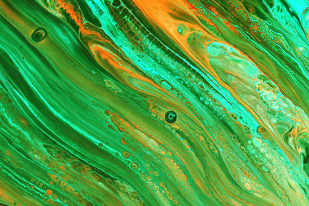 Abstract background of acrylic paint in orange tones