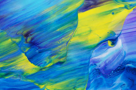 Abstract background of acrylic paint in blue violet and yellow tonesの写真素材