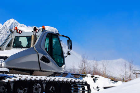 The ski slope preparation machine clears snowの写真素材