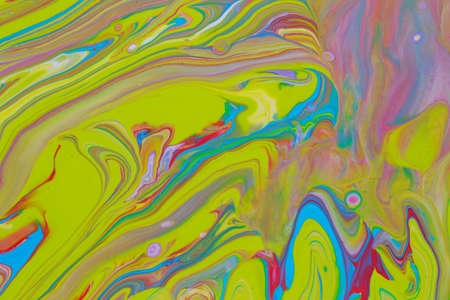 Abstract background of acrylic paint in blue red and yellow tones