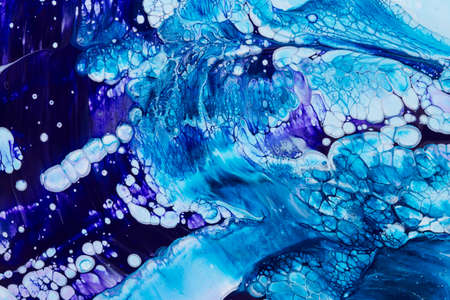 Abstract background of acrylic paint in blue and violet tone