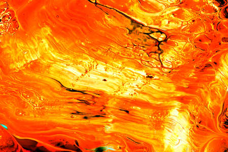 Abstract background of acrylic paint in orange tones