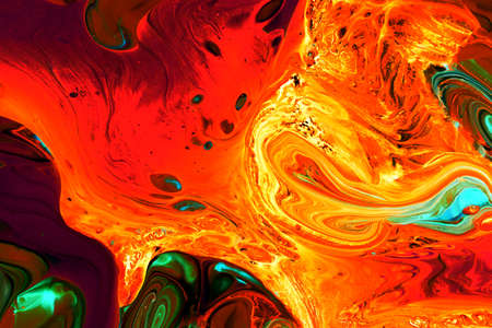 Abstract background of acrylic paints in orange and green color tones