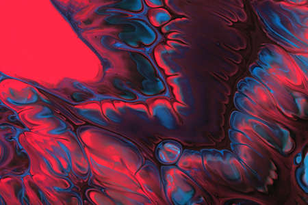 Abstract background of acrylic paints in red and blue color tones