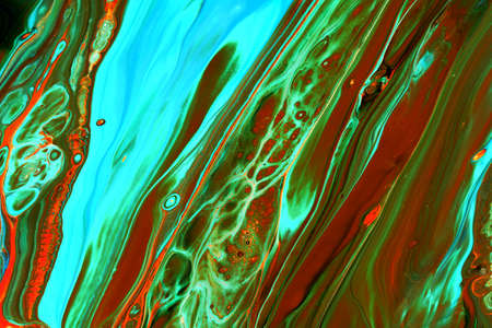 Abstract background of acrylic paints in orange and green color tones