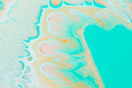 Abstract background of acrylic paints in aquamarine and orange color tonesの写真素材