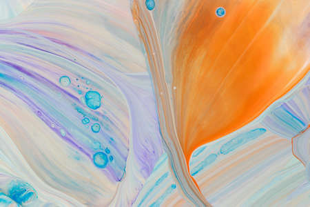 Abstract background of acrylic paints in violet and blue color tones