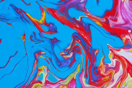 Abstract background of acrylic paint in blue red and yellow tones