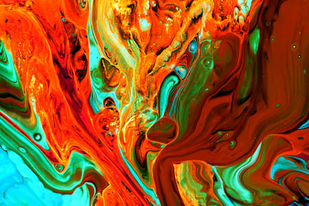 Abstract background of acrylic paints in orange and green color tones