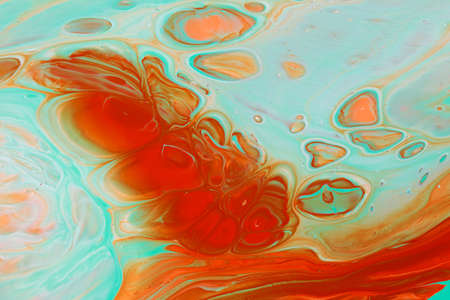 Abstract background of acrylic paints in aquamarine and orange color tonesの写真素材