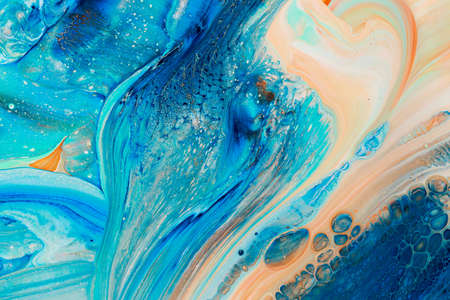 Abstract background of acrylic paints in blue and beige color tonesの写真素材