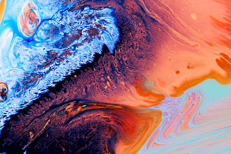 Abstract background of acrylic paints in blue and orange color tonesの写真素材