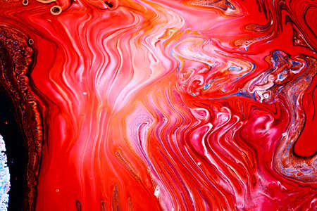 Abstract background of acrylic paints in red color tones