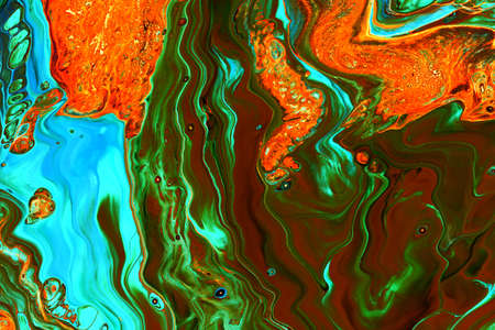 Abstract background of acrylic paints in orange and green color tones