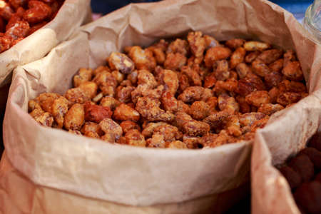 Sugar-coated cashews at a street food festivalの写真素材