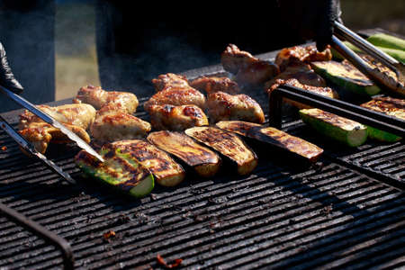 Cooking fresh zucchini grilled with chicken wings