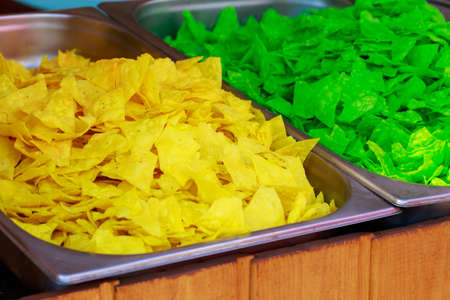 Triangular colored chips close up at the street food festival