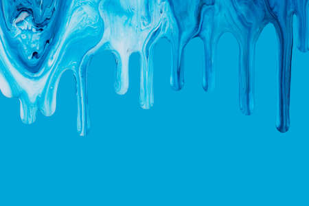 Abstract colorful acrylic paint dripping on background