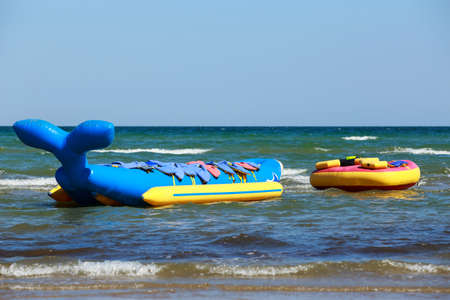 Yellow banana boat moored in the blue seaの写真素材