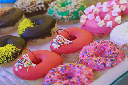 Beautiful sweet donuts in a shop window