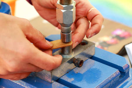 Workflow making a leather bracelet close up