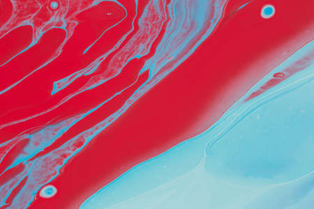 Abstract background of acrylic paint in red and blue tonesの写真素材