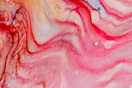 Abstract background of acrylic paint in red tones