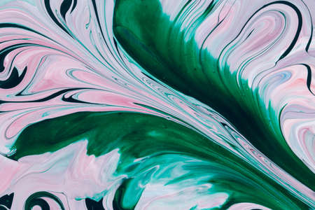 Abstract background of acrylic paint in green and pink tonesの写真素材