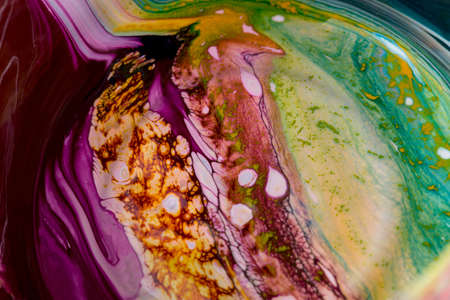 Abstract background of acrylic paint in purple and yellow tonesの写真素材