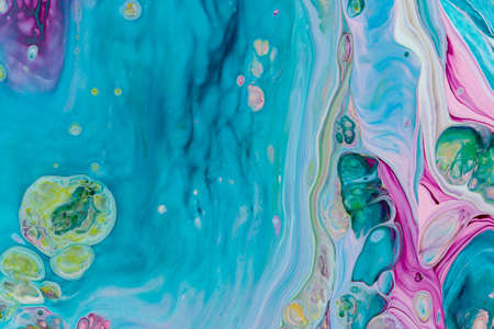 Abstract background of acrylic paint in pink and aquamarine tones