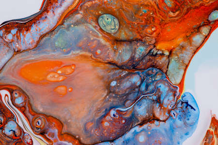 Abstract background of acrylic paint in orange tonesの写真素材