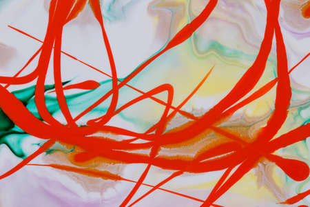 Abstract background of acrylic paint in green and orange tones