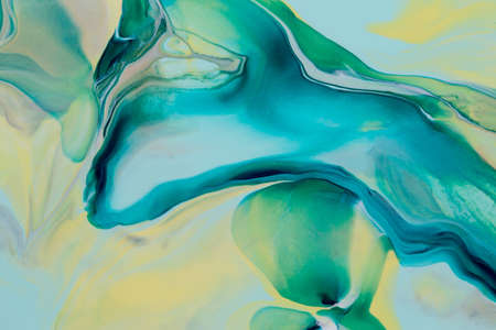 Abstract background of acrylic paint in yellow and aquamarine tones