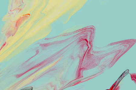 Abstract background of acrylic paint in yellow and aquamarine tones