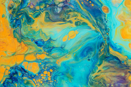 Abstract background of acrylic paint in aquamarine and yellow tones