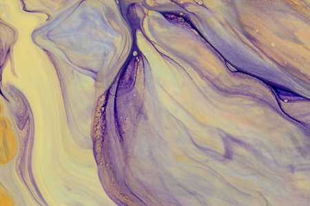 Abstract background of acrylic paint in yellow and purple tonesの写真素材