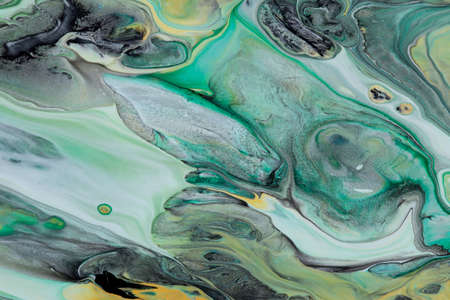 Abstract background of acrylic paint in green tones