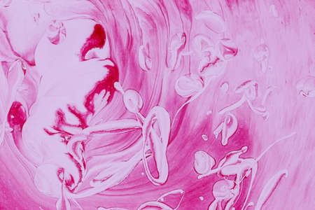 Abstract background of acrylic paint in red and pink tonesの写真素材