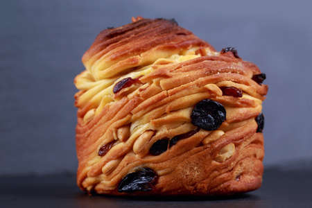 Large kraffin with raisins on a gray background