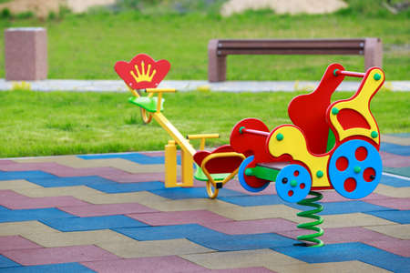 Bright swing in the playground on a spring day