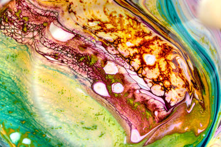 Abstract background of acrylic paint in purple and yellow tones